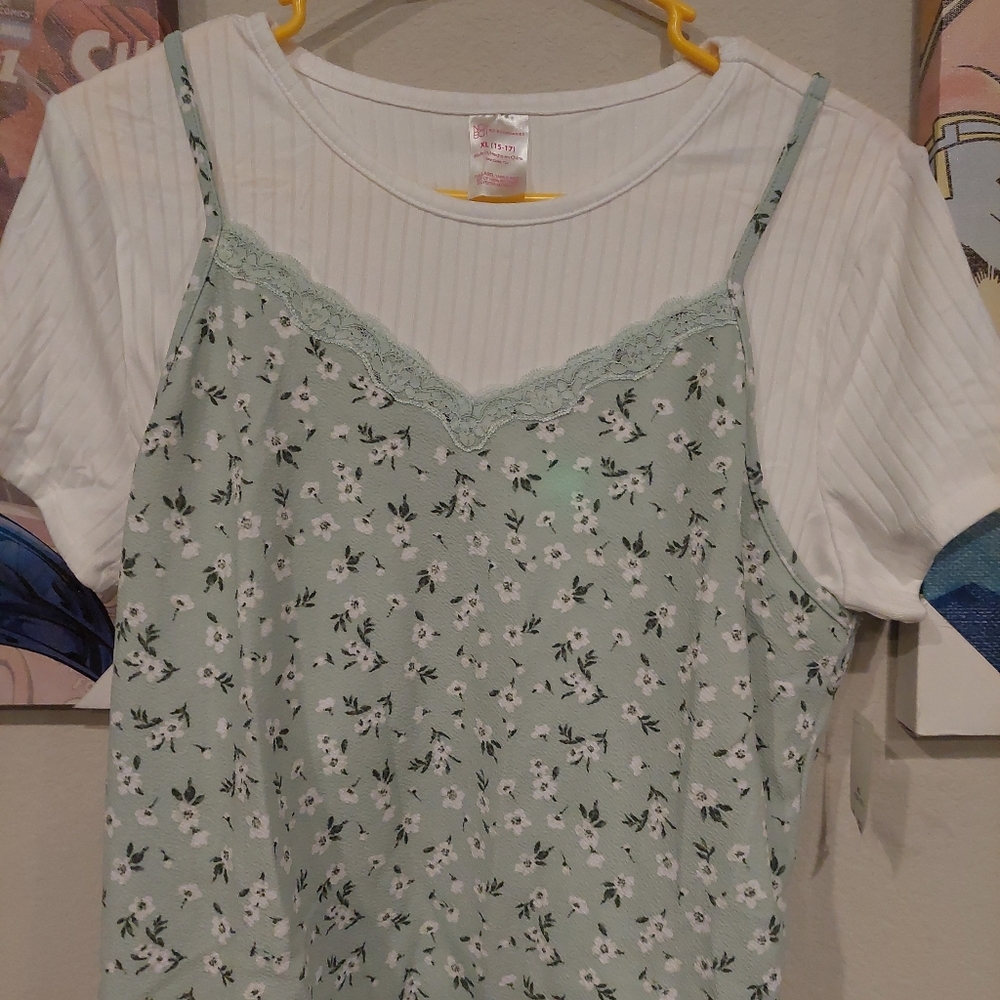 Sheer green and white green lace covered white tee shirt